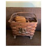 Footed basket w/ Rawlings baseball gloves,