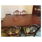Walnut? Table w/6 chairs 42' x 67, shows wear