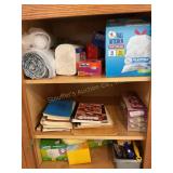 Contents of cupboard, trash bags, cookbooks etc