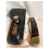 Buck 112 folding hunting knife W/brass bolster,