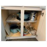 Contents of kitchen cabinet - Paula Deen pots &