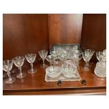 Contents of shelf vinegar, cruet glasses, sugar,