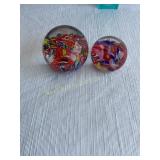 2 Glass paperweights - largest 2'