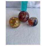 3 Glass paperweights - largest 2.5'