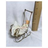 Byers? accessory, baby doll in metal carriage,