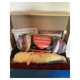 6 partial skeins yarn, knitting needles,
