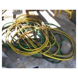 3 Misc garden hoses w/Rubbermaid 29 gal tote (no