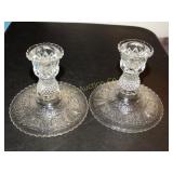 2 glass candle sticks  4" T