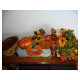 Fall decor. -Tin basket, fall flowers, etc.
