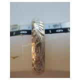 Sterling band engraved, size 8, weight .1 oz