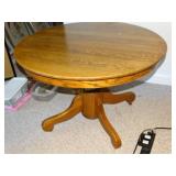 Antique 42" round oak table on casters w/board