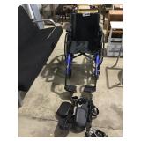 WHEELCHAIR WITH EXTRA FOOT PLATES