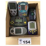 Box of Misc Handheld Electronic Games
