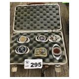 BELT BUCKLES IN HARD GUN CASE