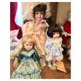 Three Girl Dolls - One with Wry Smile