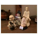 Asian Figures.....Man is a stone carving