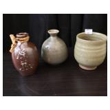 One cup and two water containers