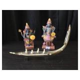 Indian figures and boat made from horn