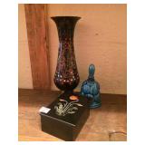 A box , a bell and a vase