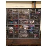 Cabinet full of jewelry making supplies