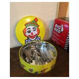 Clown tin full of creepy old syringes