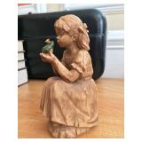 Figurine of girl kissing a frog