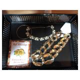 2 necklaces a bangle and a pin