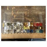 Two plastic cases of unique beads