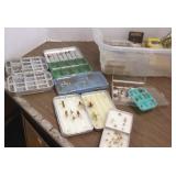 Group of assorted fishing flies in boxes