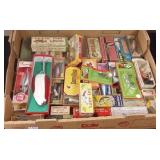Group vintage fishing lures in boxes