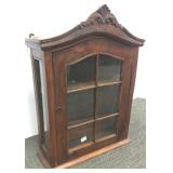 Carved wall curio cabinet