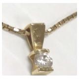 14k gold necklace with an 18k pendant set with