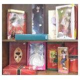 12 boxed dolls including Barbies, Marie, etc.