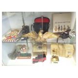 Group of small collectibles including toys, phone,