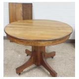 42" diameter pedestal table with 3 leaves