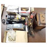 Group of toy cars, motorcycles, clock & movement