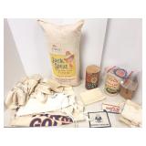 Group including flour sacks, oatmeal cartons, etc.