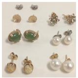 Group of gold earrings, backs including jade,