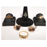 6 tested gold rings set with stones- some