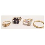 4 tested gold rings - some set with stones -10