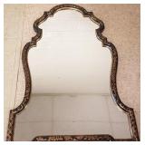 Ornately gilt & ebonized framed mirror 34" x 49"