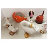 Group of figural items including cat container,