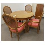38" diam. dining room table with one 18" leaf & 4
