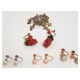 Group vintage jewelry including gold earrings,