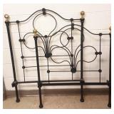 Iron twin bed with brass finials & rails