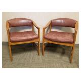 Pair of Dunbar signed oak & tufted leather chairs