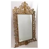 Beveled mirror in ornate brass frame 19" x 31"