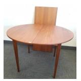 Teak 43" diameter dining table with 21" leaf