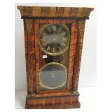 Antique calendar clock in wooden case 27" high