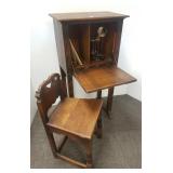 Oak Spanish revival carved telephone stand,